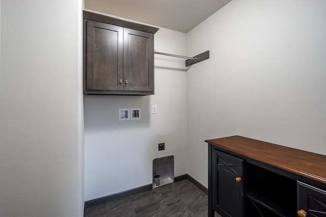 washroom featuring washer hookup, electric dryer hookup, and cabinets