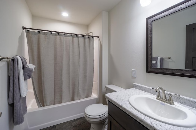 full bathroom featuring shower / bath combination with curtain, vanity, and toilet