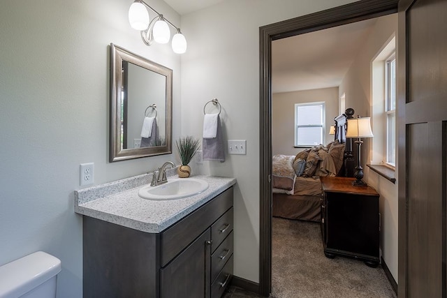 bathroom featuring vanity and toilet