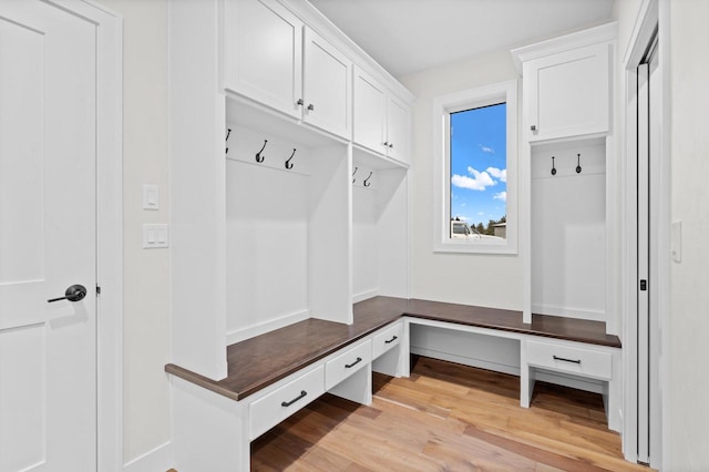 mudroom with light hardwood / wood-style flooring