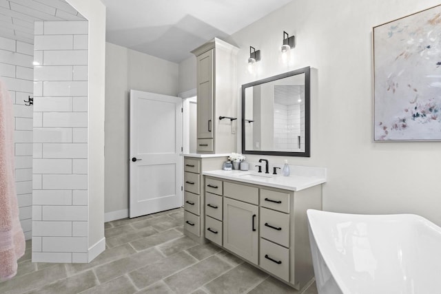 bathroom featuring a tub to relax in and vanity