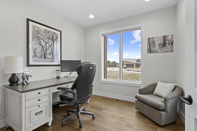 home office with light wood-type flooring