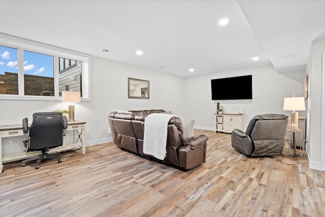 living room with light hardwood / wood-style flooring