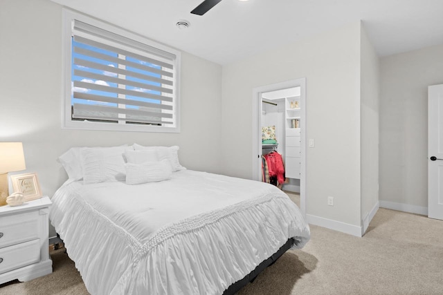 bedroom featuring ceiling fan and light colored carpet