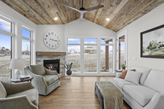 living room featuring wooden ceiling, wood-type flooring, and plenty of natural light