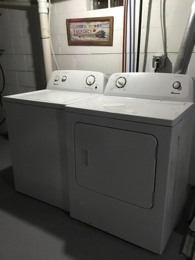 1002 7th Aly, Crivitz, WI 54114 - washroom with concrete block wall and separate washer and dryer