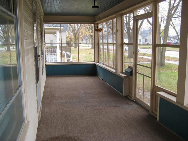 unfurnished sunroom featuring a healthy amount of sunlight