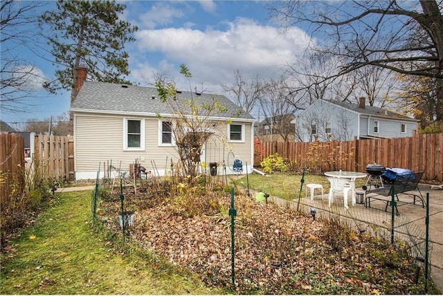 rear view of house featuring a patio area