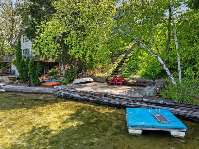 exterior space with a deck with water view