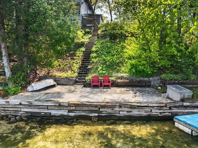 wooden deck featuring a water view