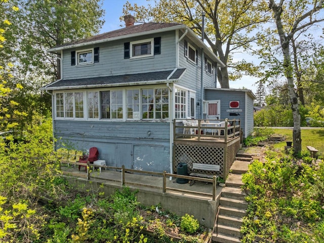 rear view of property with a deck