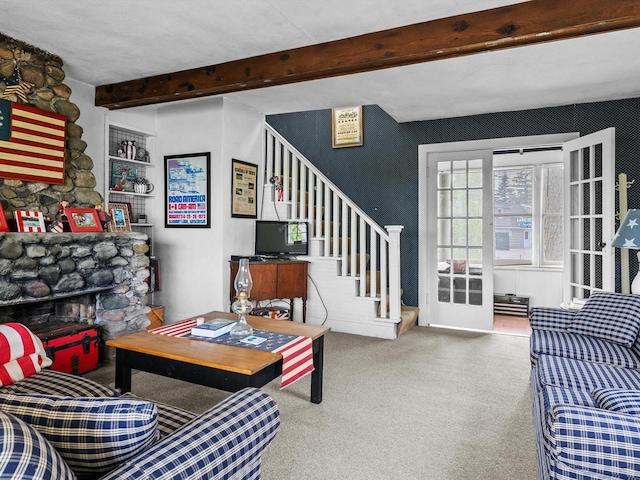 living room with beamed ceiling and a fireplace