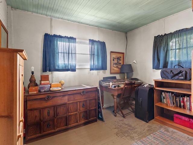 office area with a wealth of natural light and light hardwood / wood-style flooring