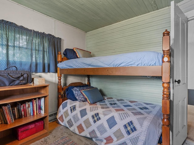 bedroom with wooden ceiling and a baseboard radiator