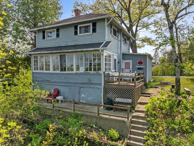 W6540 County Road C, Plymouth, WI 53073 - rear view of property with a chimney, a wooden deck, and stairs