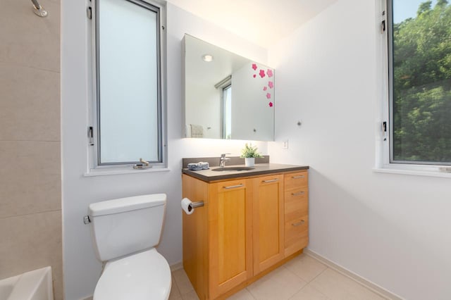 bathroom with tile patterned floors, vanity, and toilet