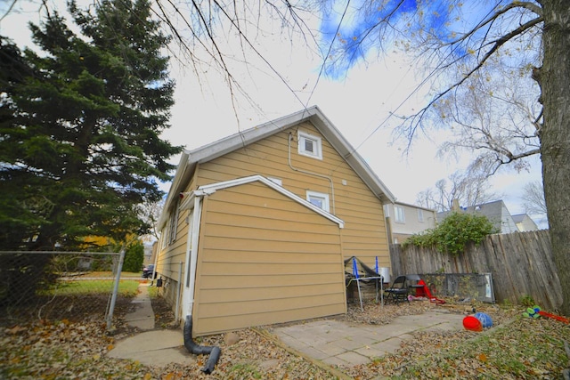 view of property exterior featuring a patio area