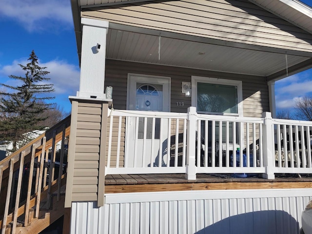 property entrance with covered porch