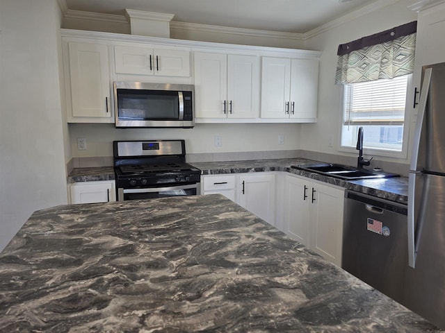 1407 N Peach Ave Unit 119, Marshfield, WI 54449 - kitchen with appliances with stainless steel finishes, white cabinetry, crown molding, and dark stone countertops