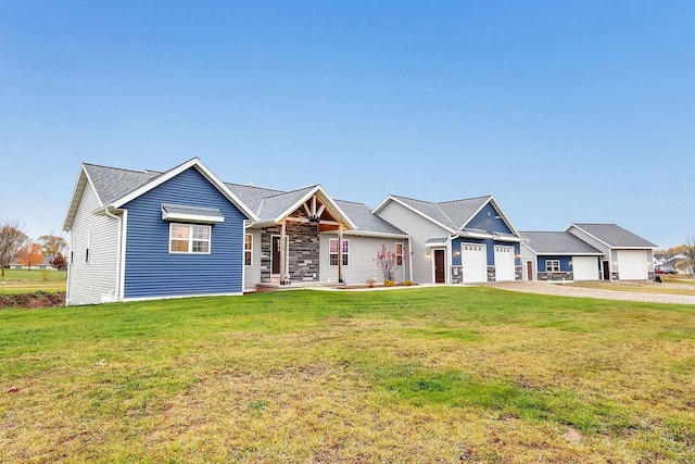 view of front of home featuring a front yard and a garage