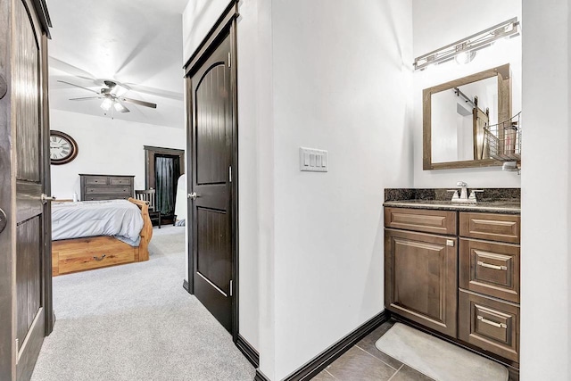 bathroom featuring vanity and ceiling fan