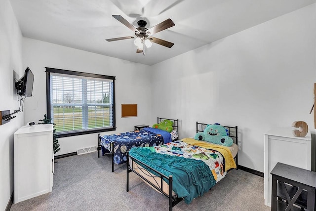 carpeted bedroom with ceiling fan