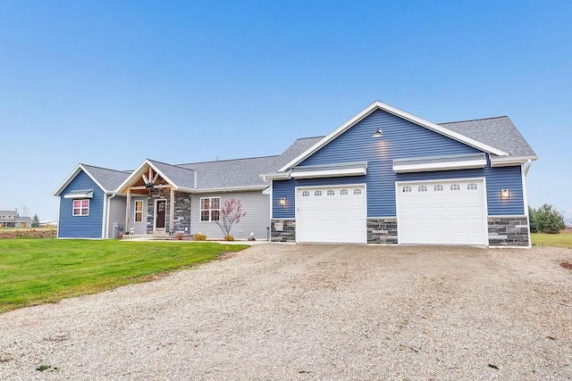 view of front of home with a garage and a front yard