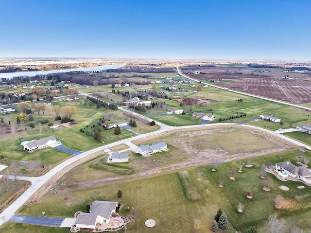 aerial view with a water view and a rural view