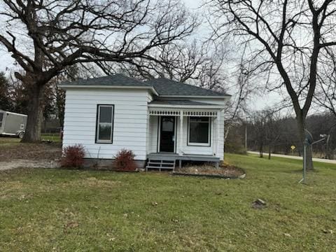 back of house with a yard