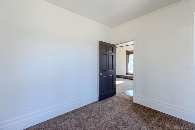 carpeted spare room featuring ornamental molding