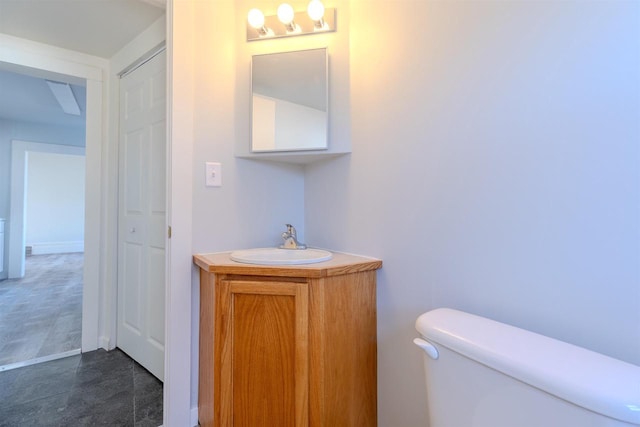 bathroom with vanity and toilet