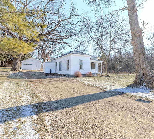 view of front of home featuring an outbuilding and a garage