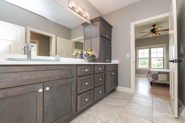 bathroom featuring vanity and ceiling fan