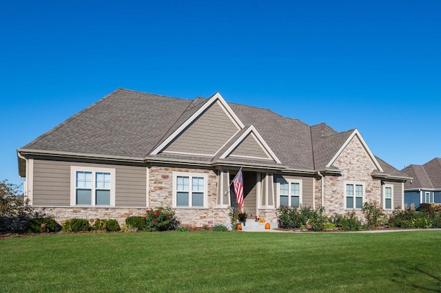 craftsman-style home with a front lawn