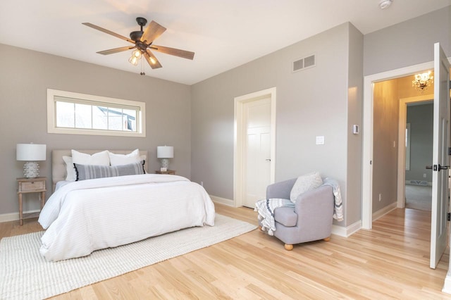 bedroom featuring light hardwood / wood-style flooring and ceiling fan