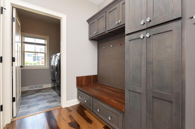 mudroom featuring separate washer and dryer and dark hardwood / wood-style floors