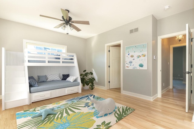 bedroom with ceiling fan and light hardwood / wood-style flooring