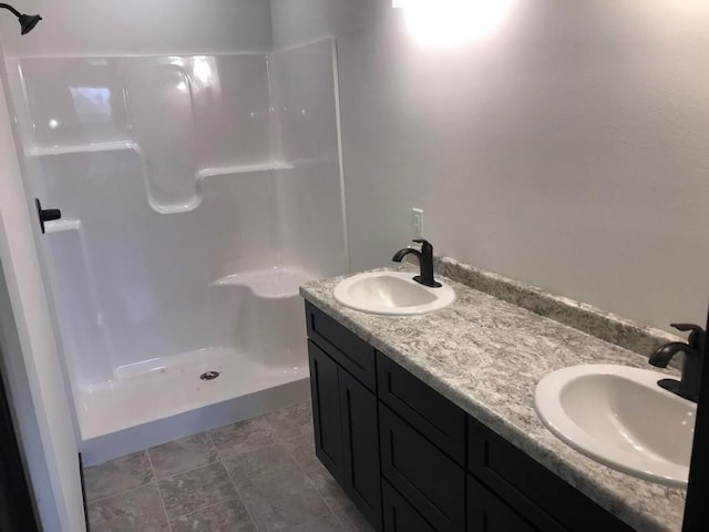 bathroom with vanity and walk in shower