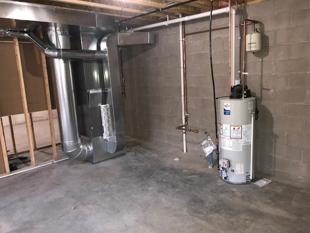 utility room featuring heating unit and water heater