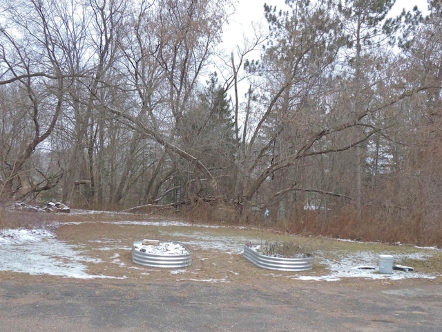 view of yard layered in snow