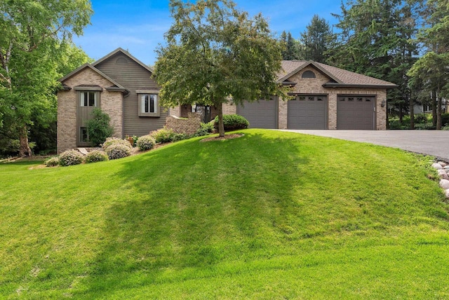 view of front of house featuring a front lawn and a garage