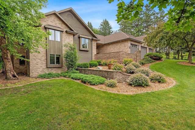 view of front of house featuring a garage and a front lawn