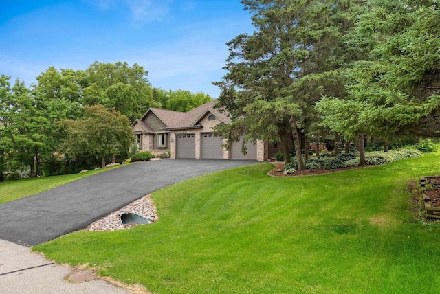 view of front of home with a garage and a front yard