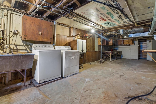 basement featuring washing machine and clothes dryer