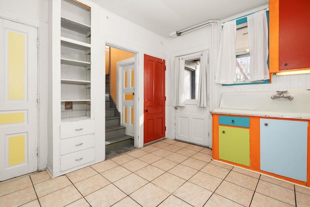 kitchen with light tile patterned flooring