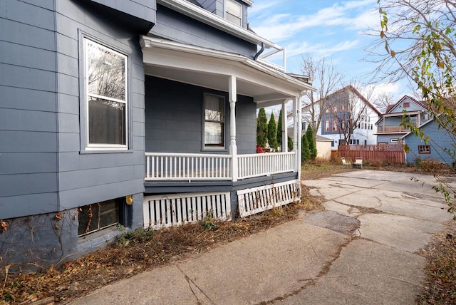 view of side of property featuring a porch