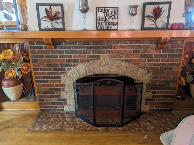 details featuring a fireplace and hardwood / wood-style floors