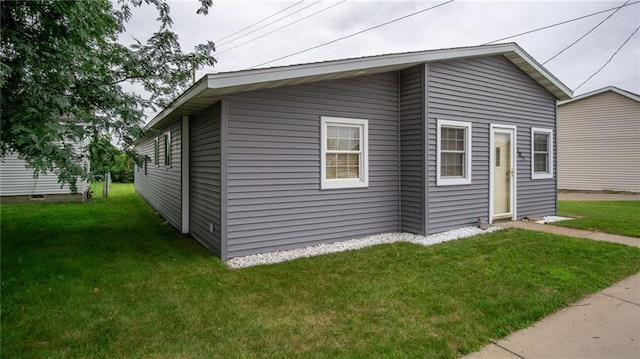 view of home's exterior featuring a yard