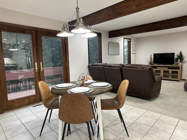 6641 N Kennedy Rd, Milton, WI 53563 - dining room with light tile patterned flooring, beam ceiling, and light colored carpet