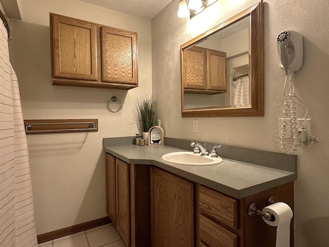 bathroom with tile patterned flooring and vanity